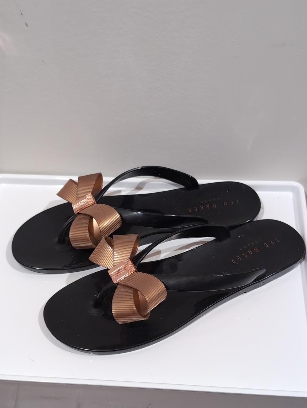 Ted Baker Black Flip Flop Sandals with Bronze Bow